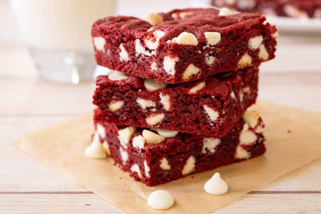 stack of red velvet cake mix cookie bars with white chocolate chips