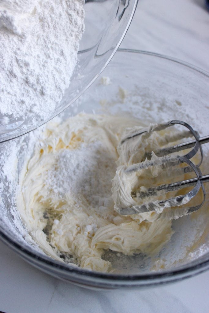 mixing powdered sugar into the creamed butter