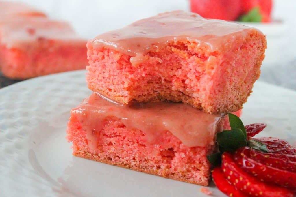 plate with two cake mix strawberry brownies with strawberry glaze