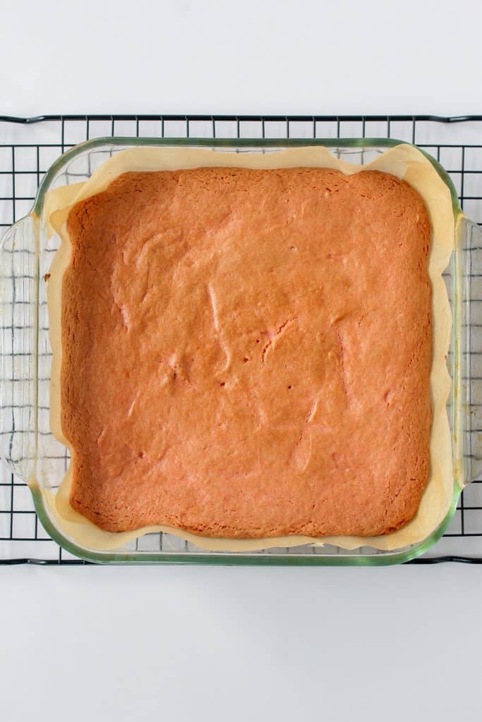 strawberry brownies fresh out of the oven on a cooling rack