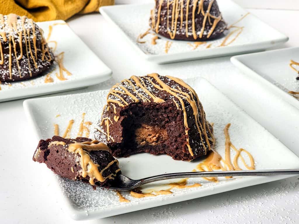 mini peanut butter and chocolate cake cut open to reveal peanut butter filling