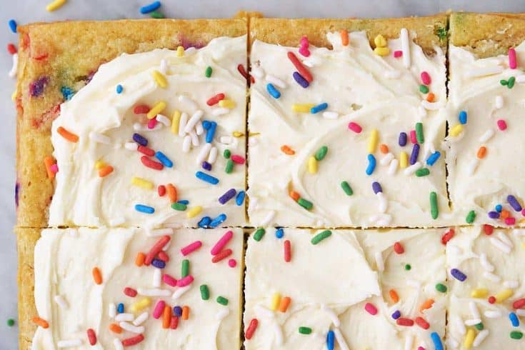 close up top view of funfetti birthday cake blondies on marble counter