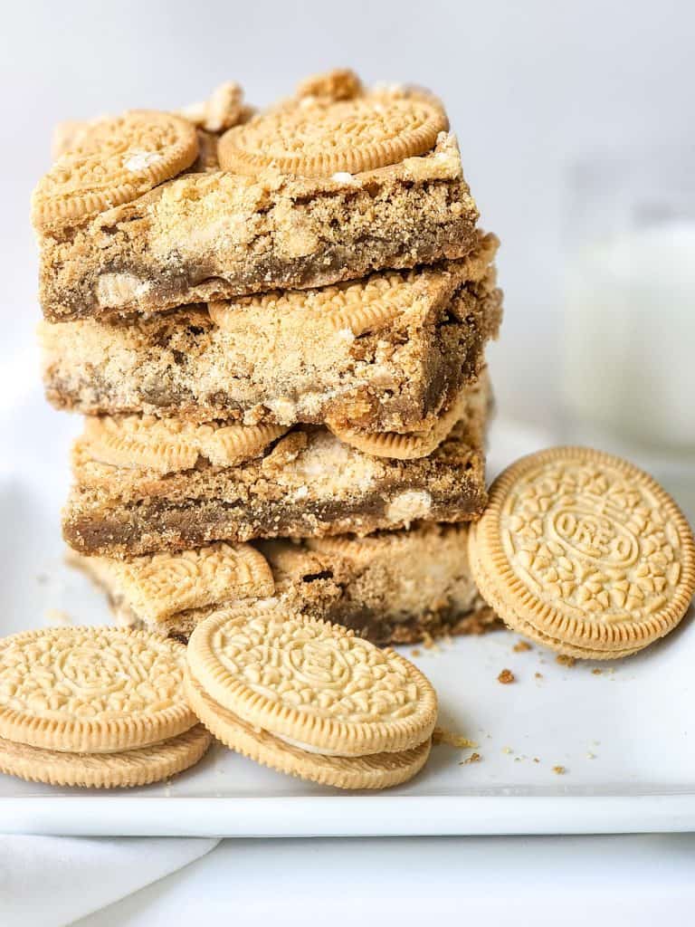 stack of oreo blondies and golden oreos on a plate