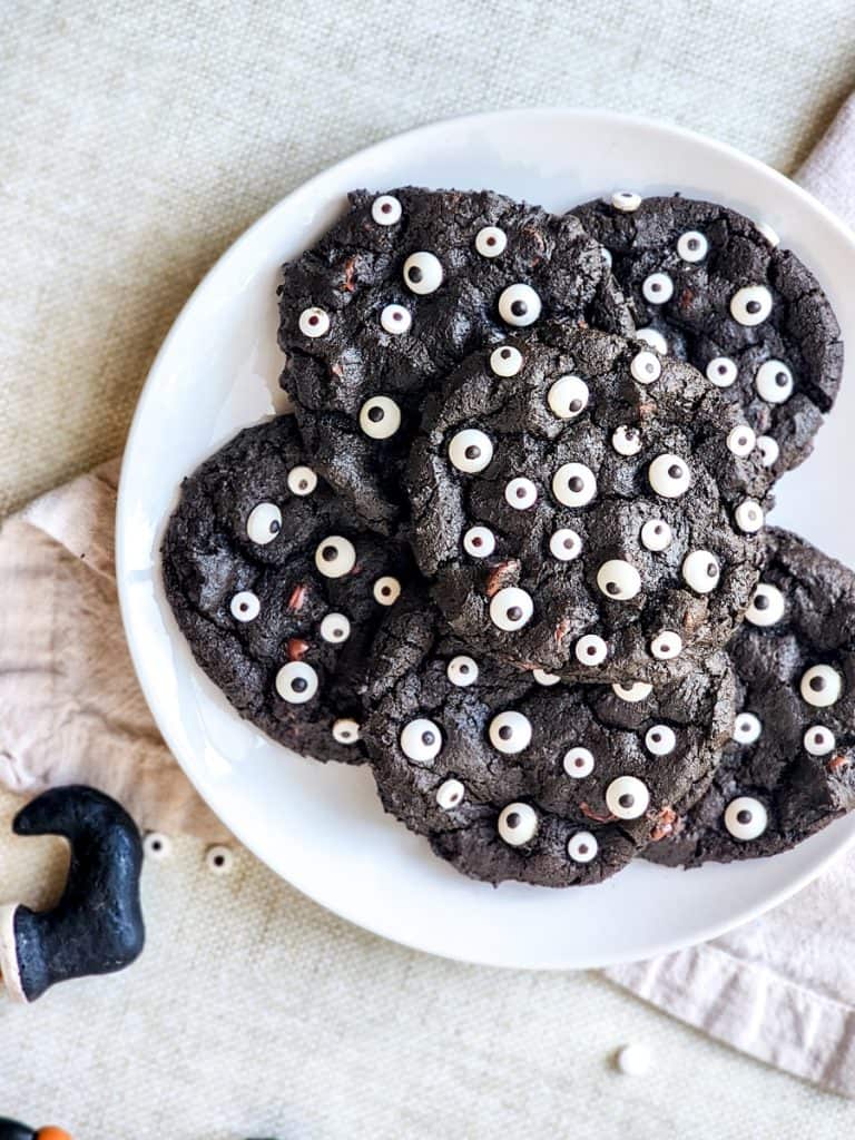 plate of finished halloween monster chocolate chip cookies