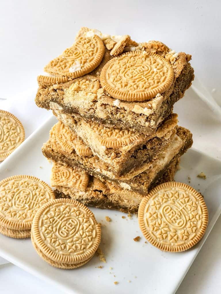 stack of blondies and golden oreos on a plate