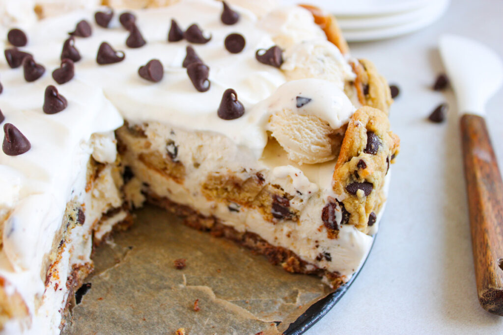 chocolate chip cookie dough ice cream cake with slice taken out of it