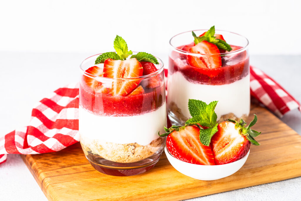 strawberry desserts in two glasses on a table