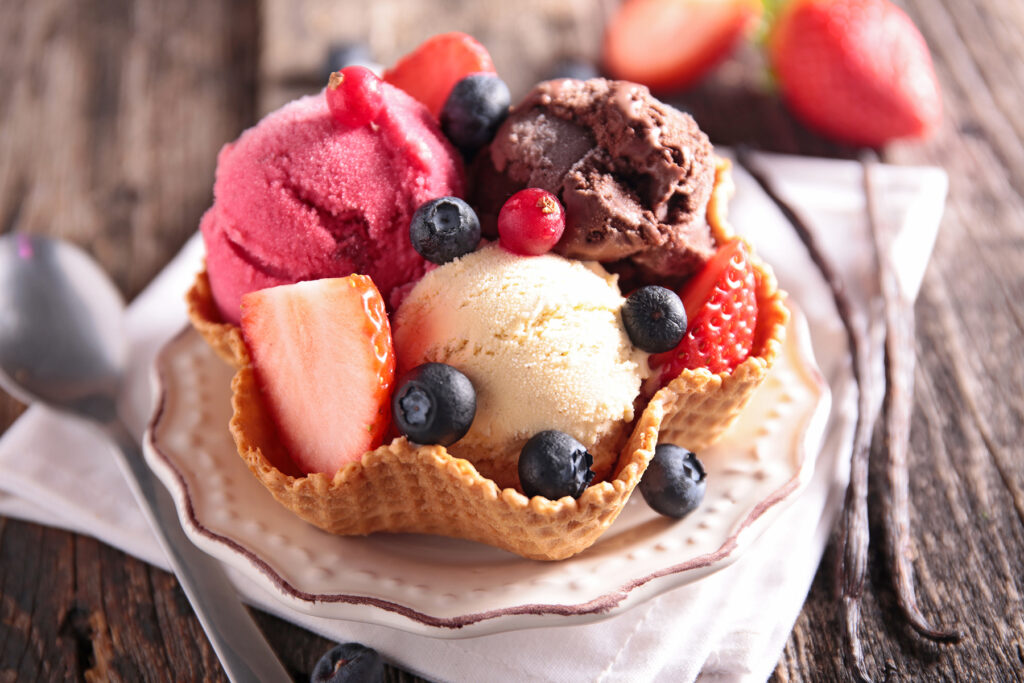 ice cream and fruit in a waffle bowl