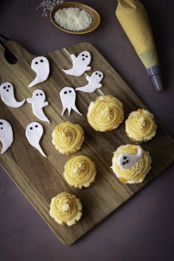 applying ghosts to the mini cheesecakes