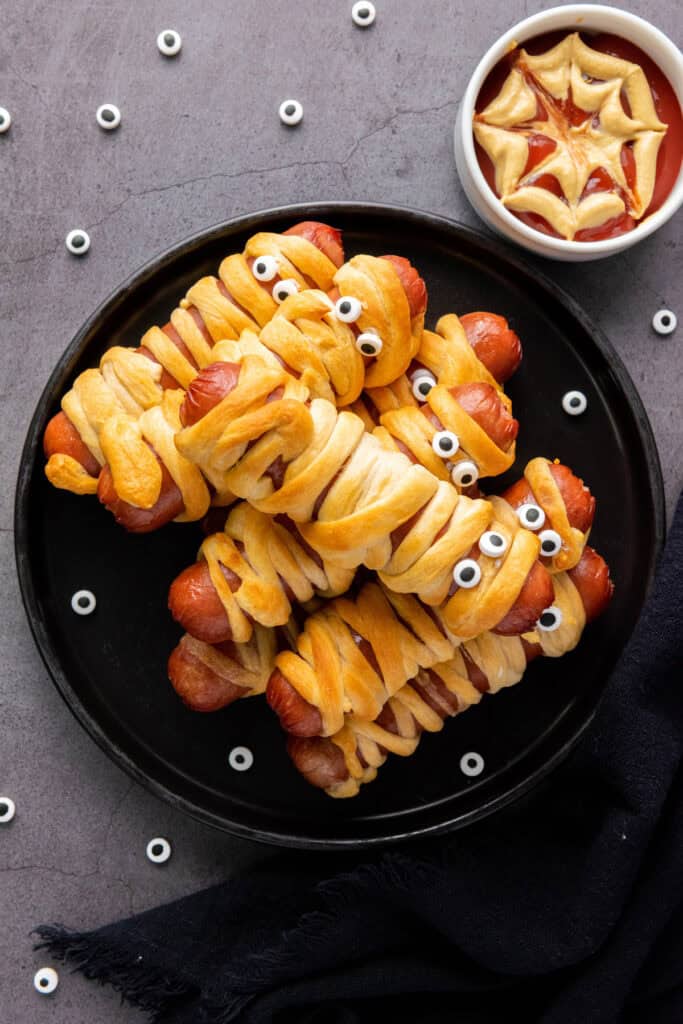 finished halloween mummy hot dogs on a plate