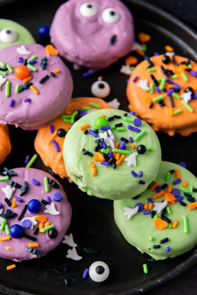 closeup of halloween oreo treats on a plate