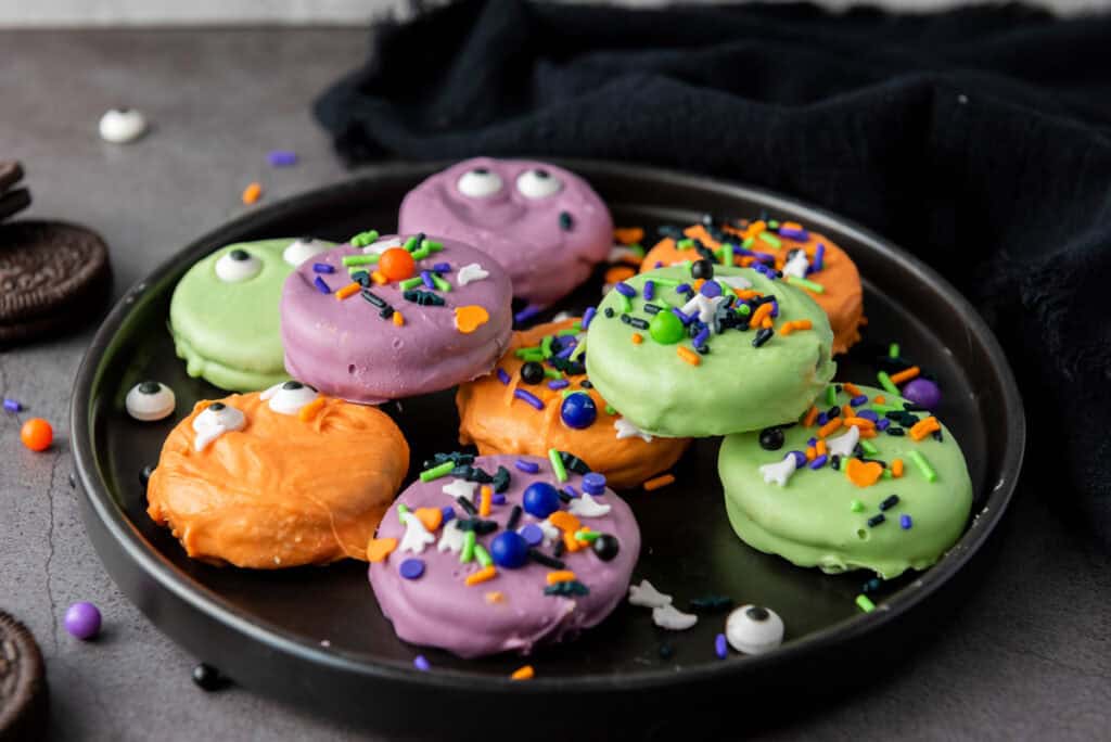 halloween candy coated oreos on a plate