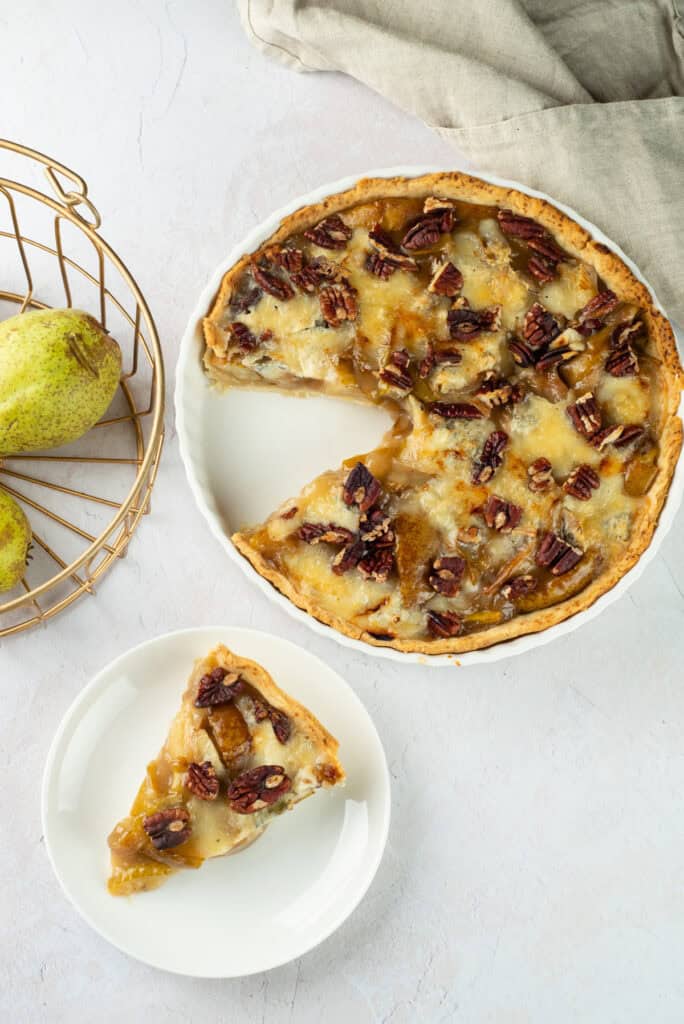 closeup of pear blue cheese pecan tart on counter