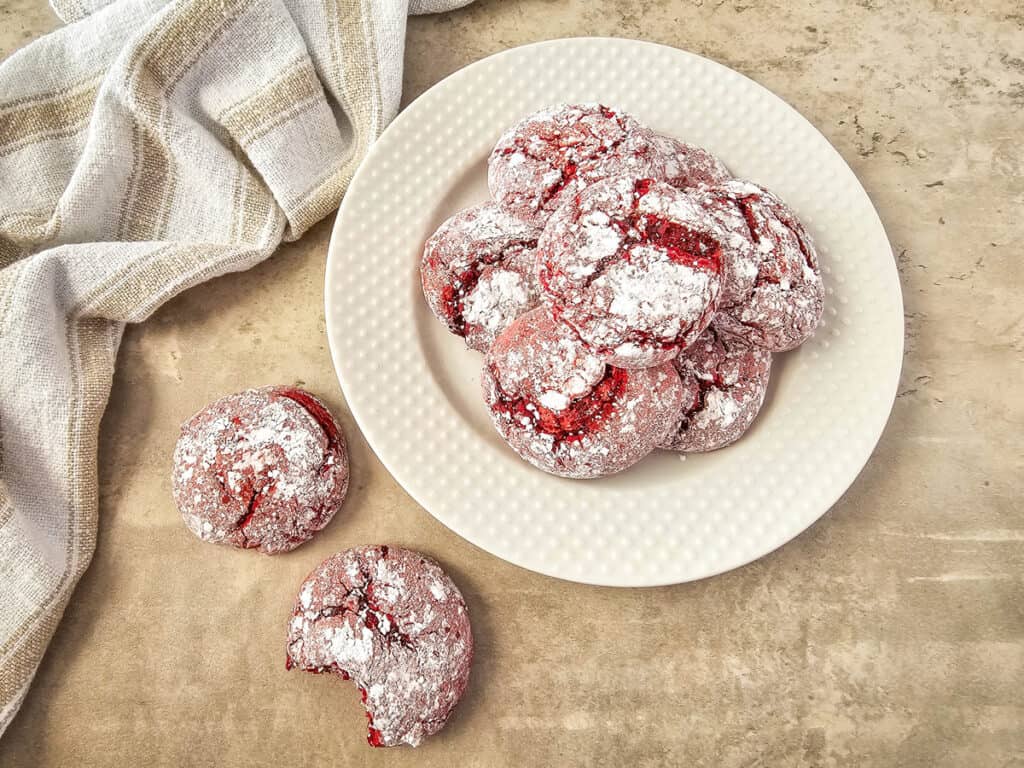 cookies stacked on a plate and on the counter