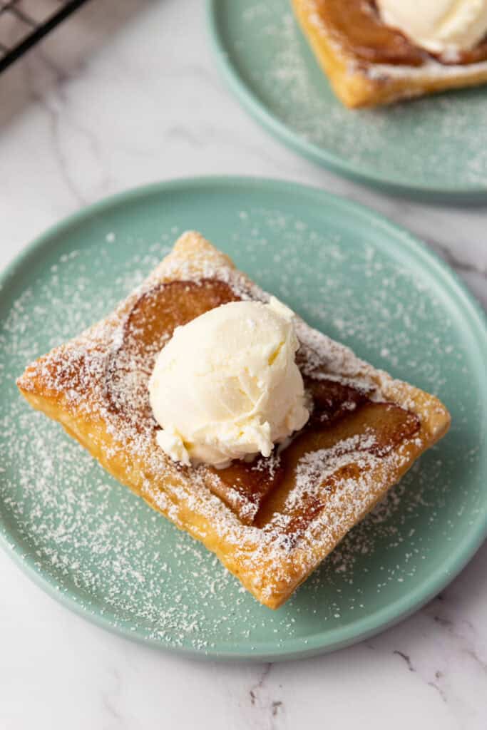 overhead shot of finished puff pastry apple tart on a plate