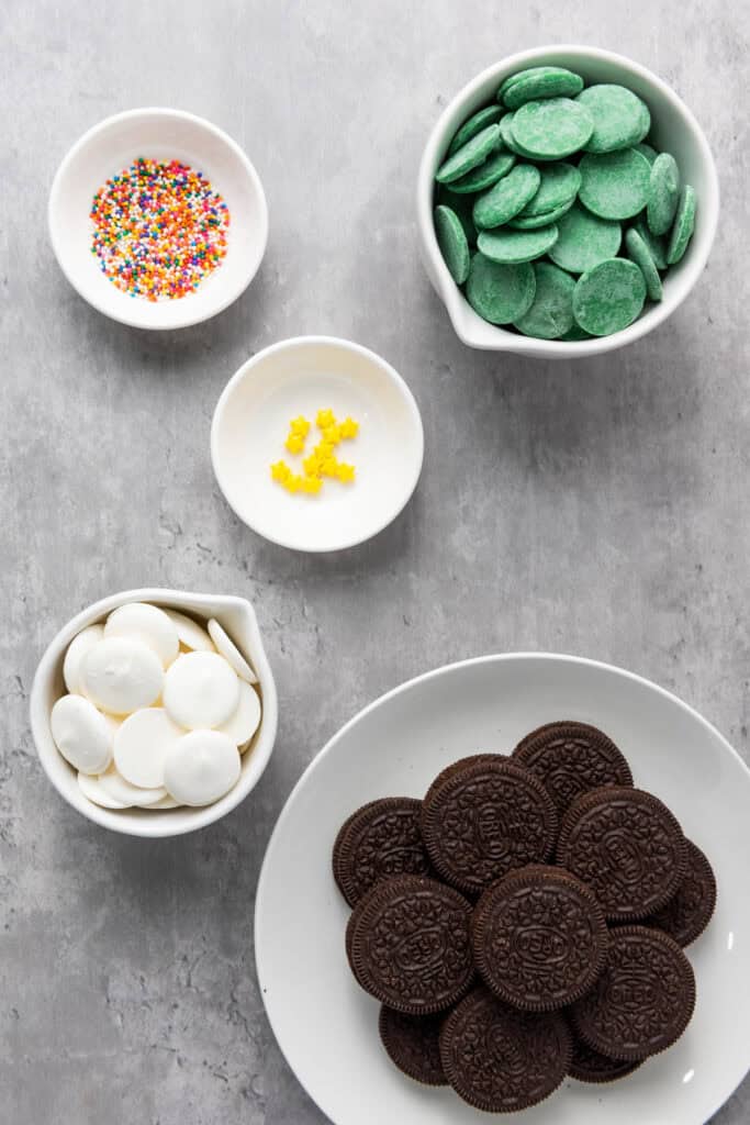 ingredients for christmas tree oreos on a counter