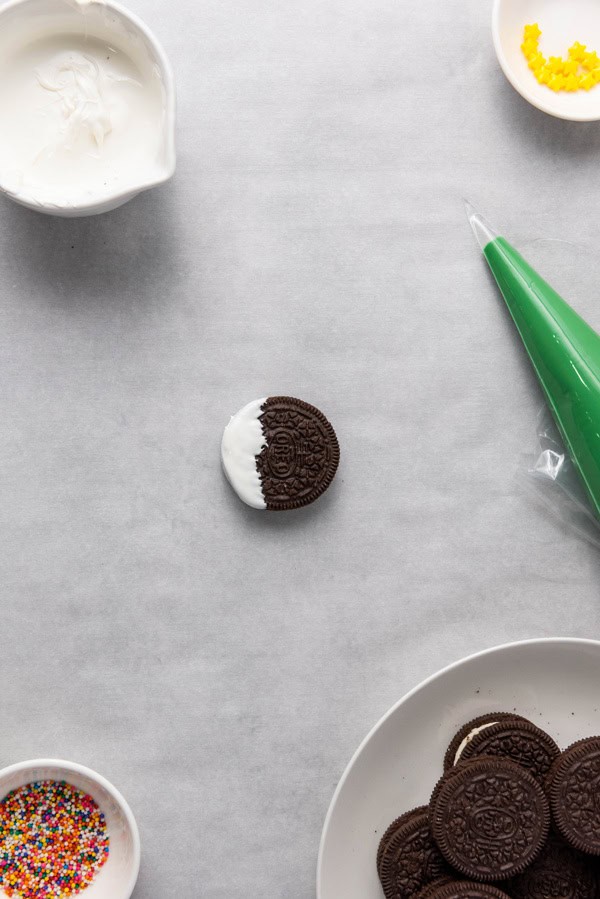 oreo dipped in white candy to look like snow