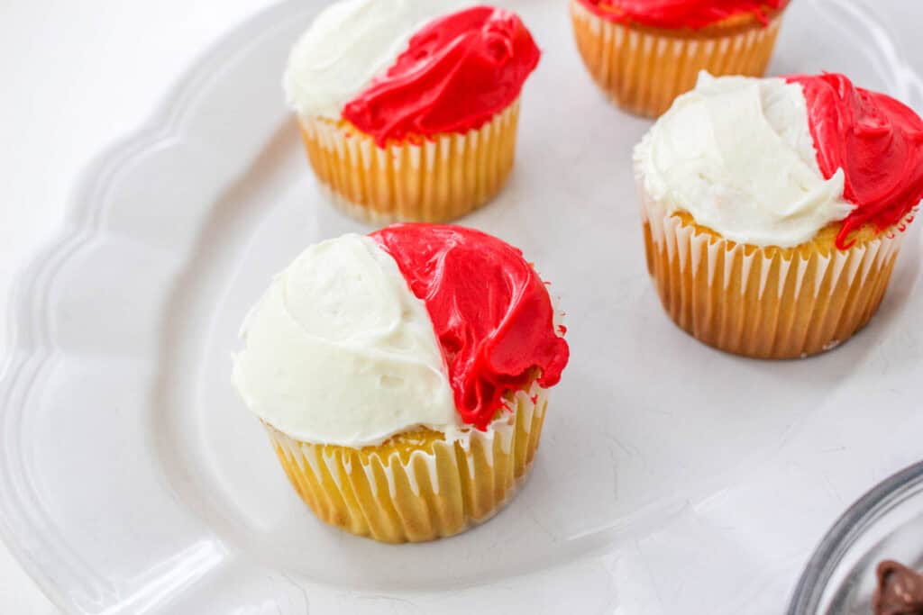 red and white frosting on cupcakes