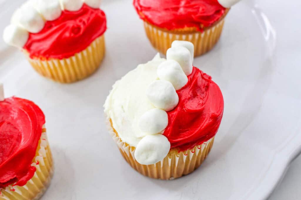 cupcakes with marshmallows pressed on the red icing