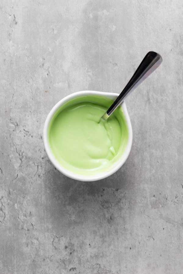 melted green candy melts in a bowl