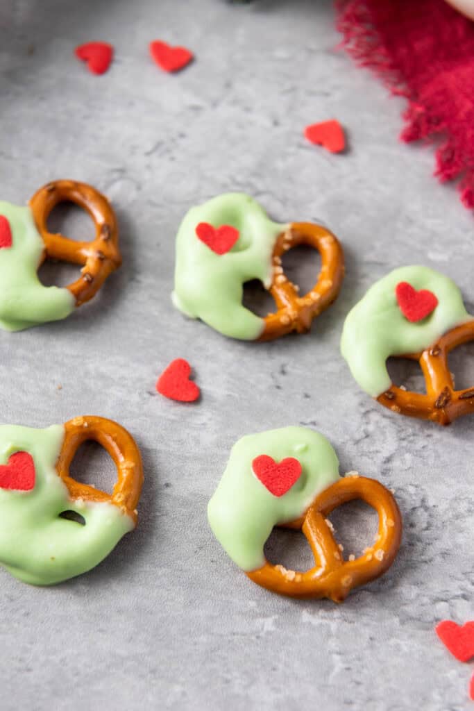 closeup shot of grinch christmas pretzels on countertop 