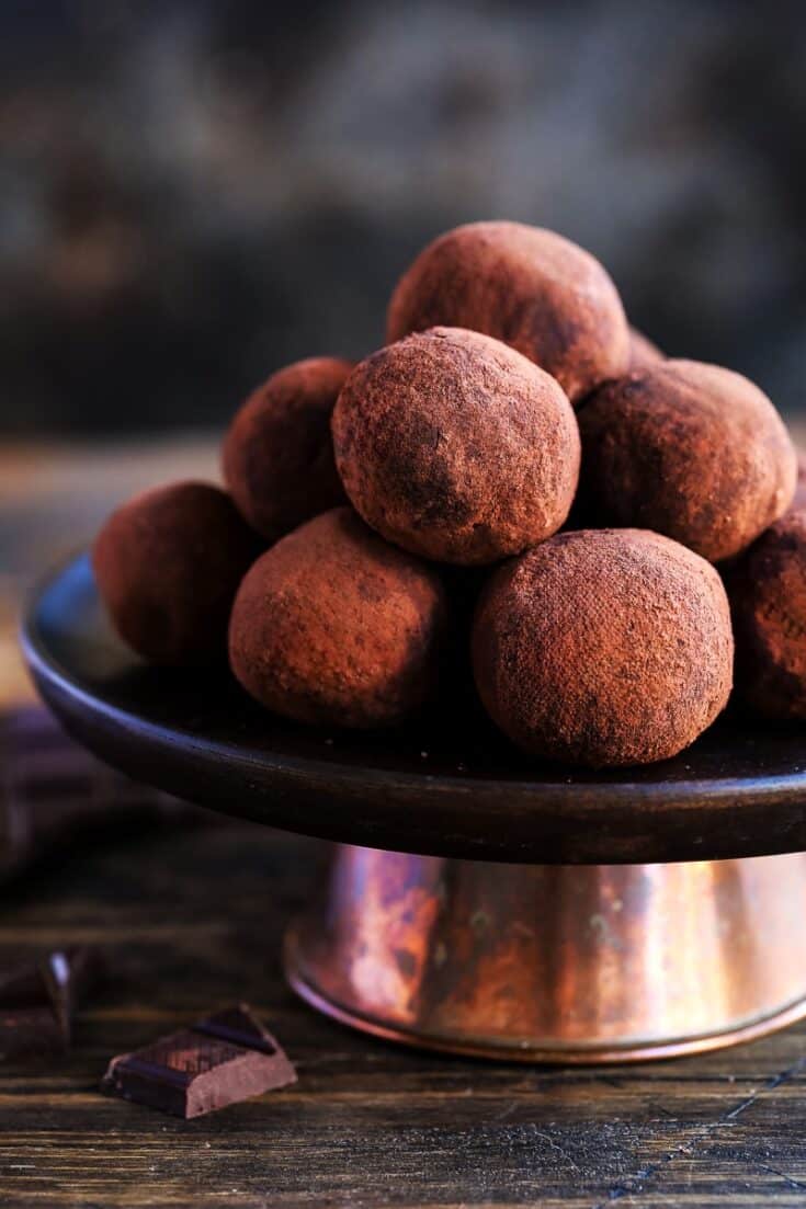 Chocolate truffles in a pile on a cake stand