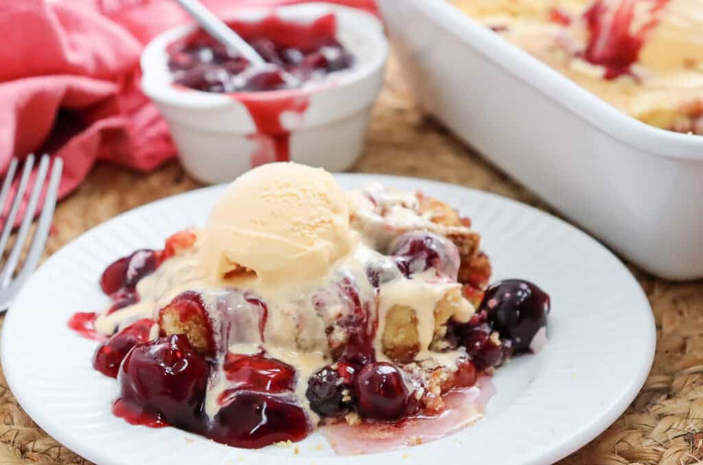 cherry dump cake with ice cream on top