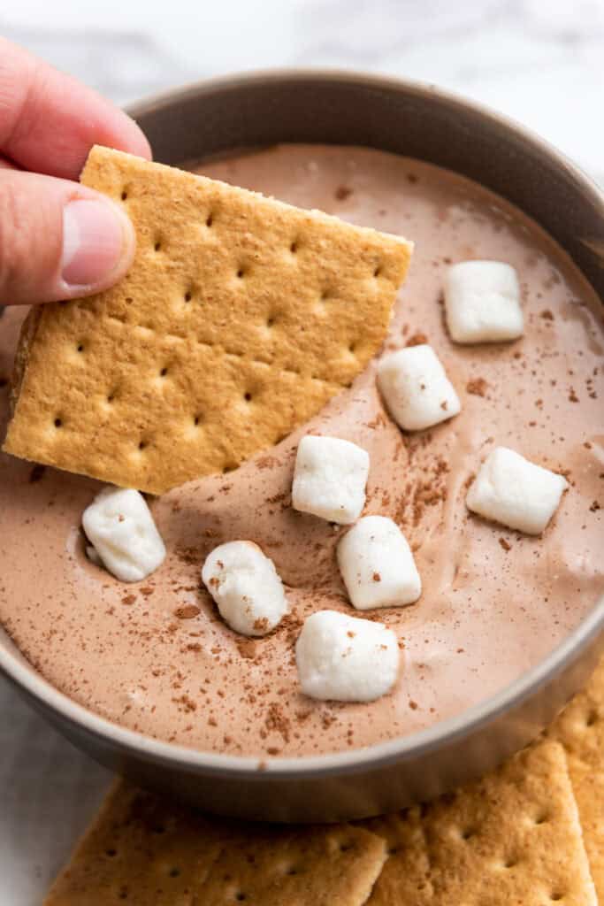 closeup of hot cocoa dip on a cracker