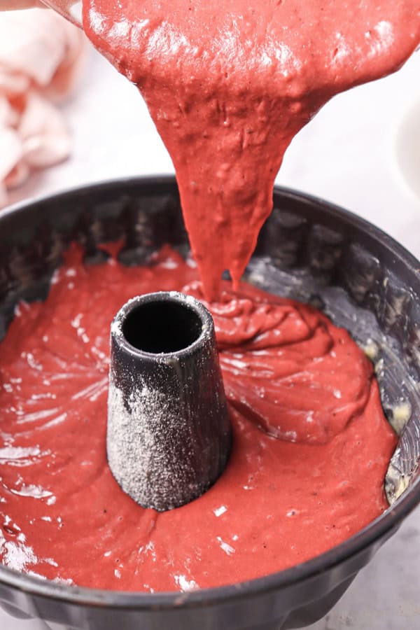 pouring batter into bundt cake pan