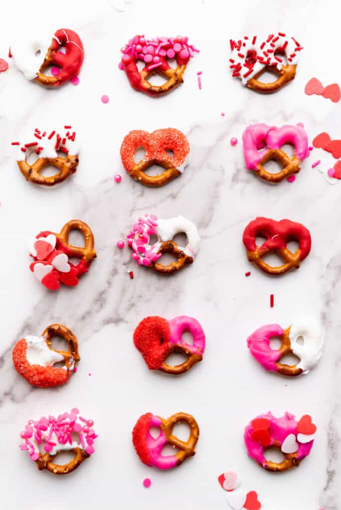 overhead shot of pretzels with different types of sprinkles