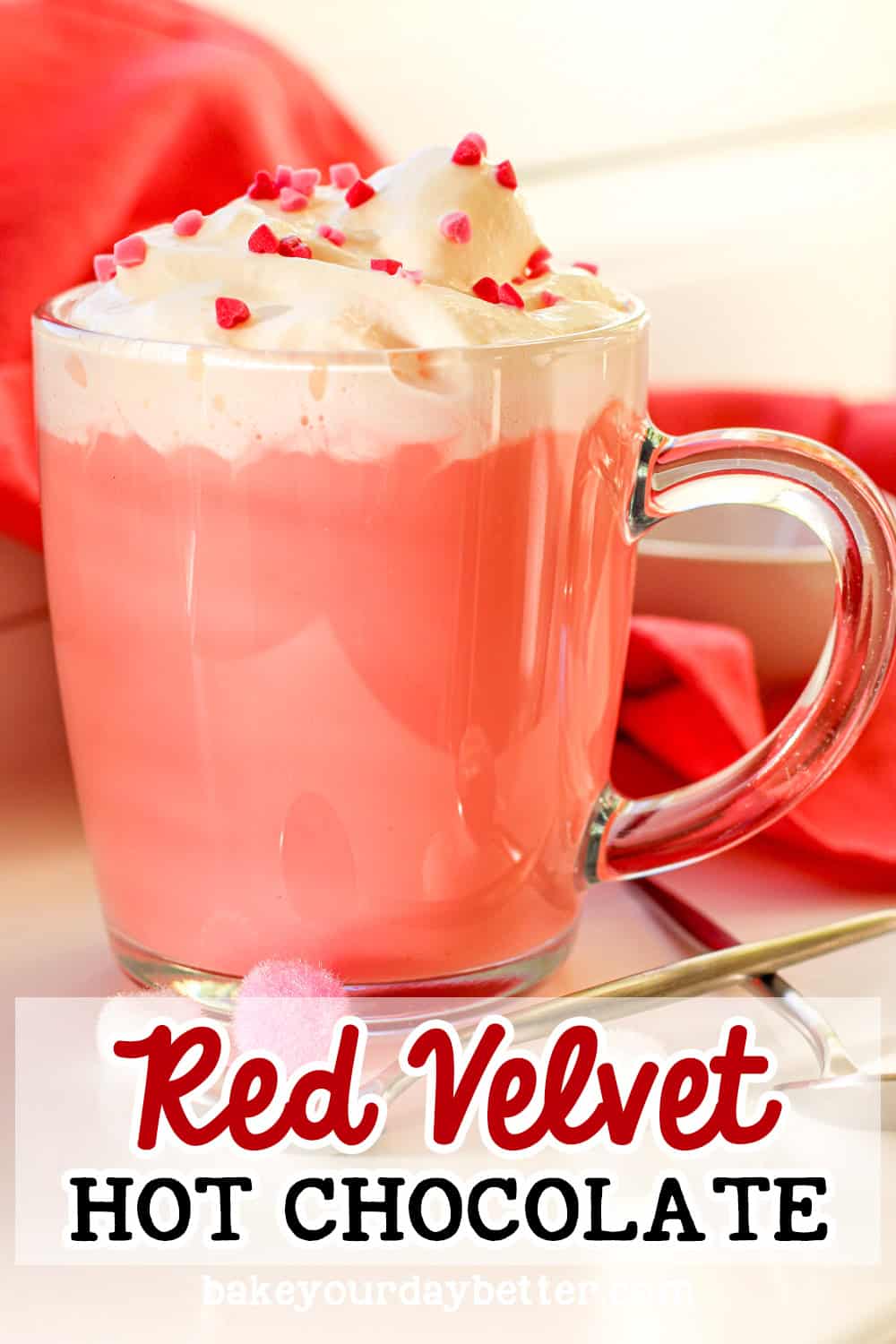 red velvet hot chocolate with whipped cream and heart sprinkles