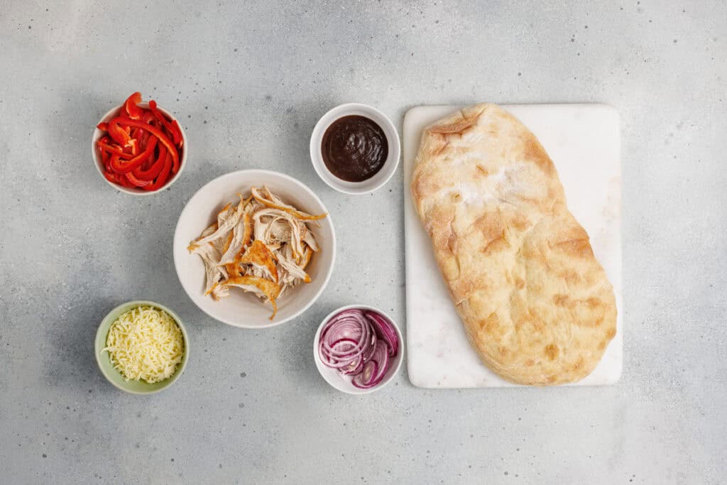 overhead shot of ingredients for bbq chicken flatbread