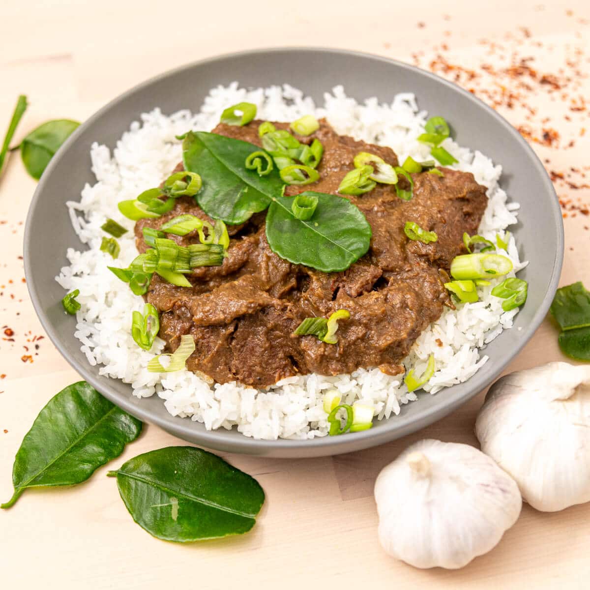 beef rendang with lime leaves and scallions