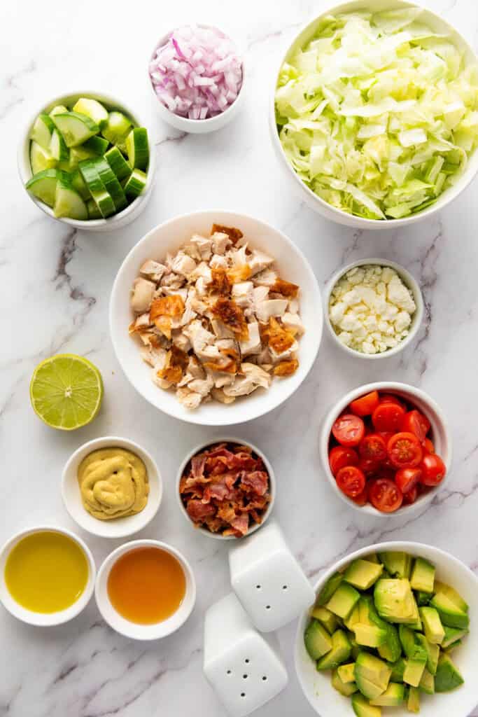 ingredients for chopped salad with rotisserie chicken and honey mustard dressing