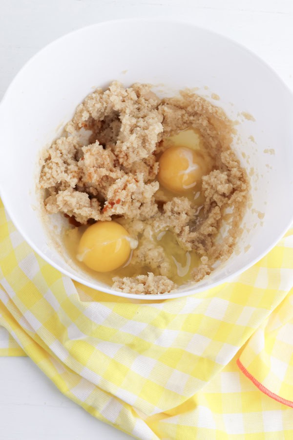 adding eggs to banana bread batter