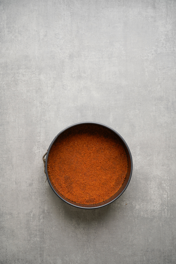 press biscoff cookie mixture into bottom of the pan