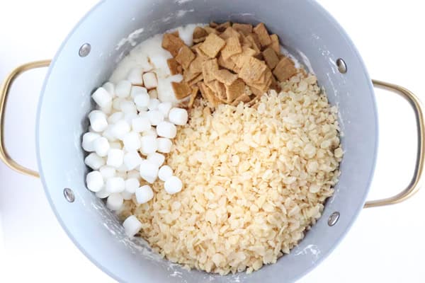 melt the cereal and marshmallows into the melted butter mixture