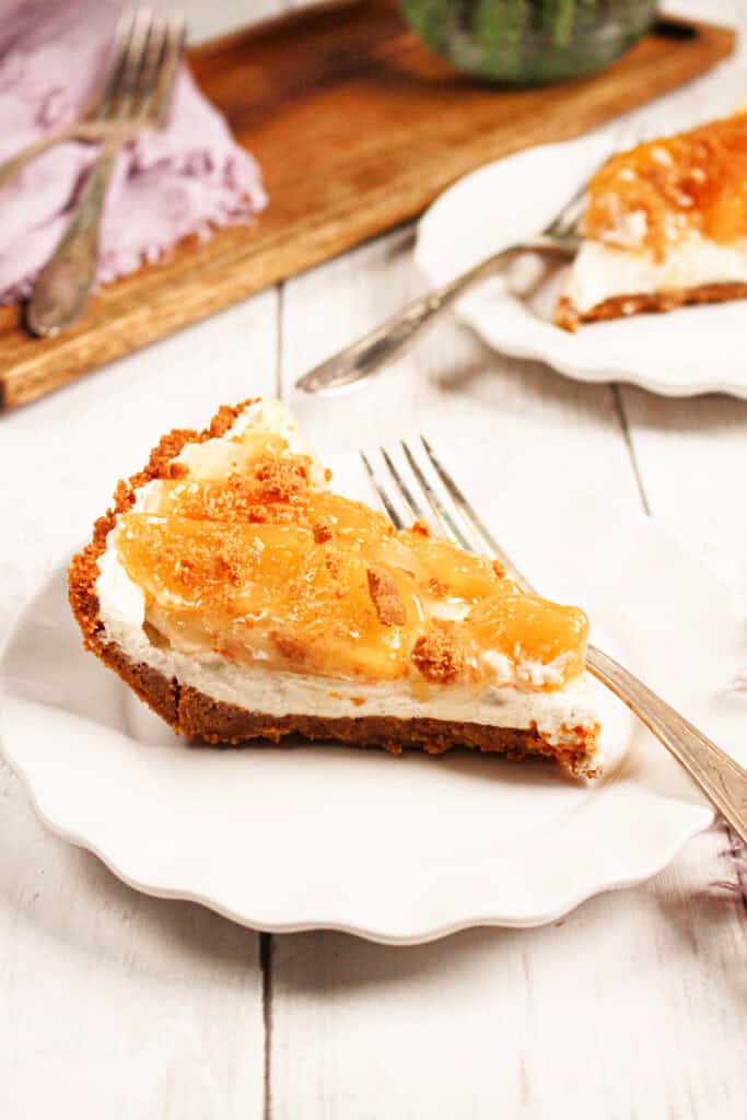 closeup shot of peach biscoff pie on a plate