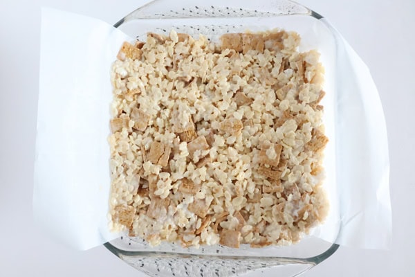 Press mixture into prepared baking dish.