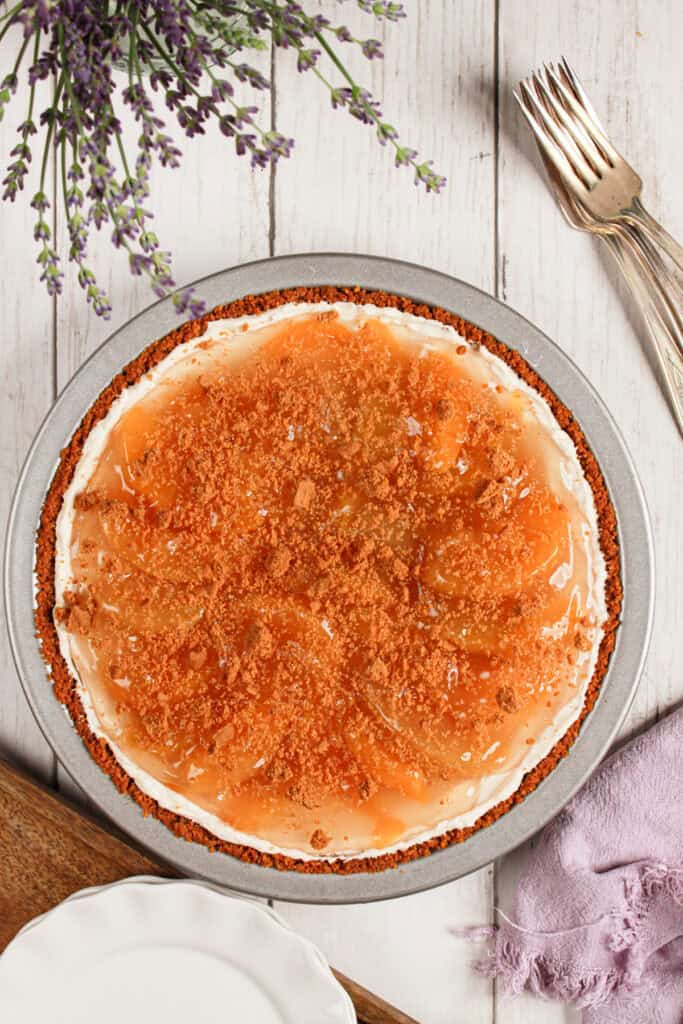 closeup of finished pie after peach topping 