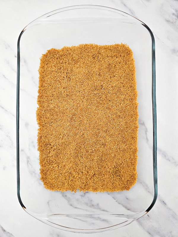 press graham cracker layer into the bottom of the dish