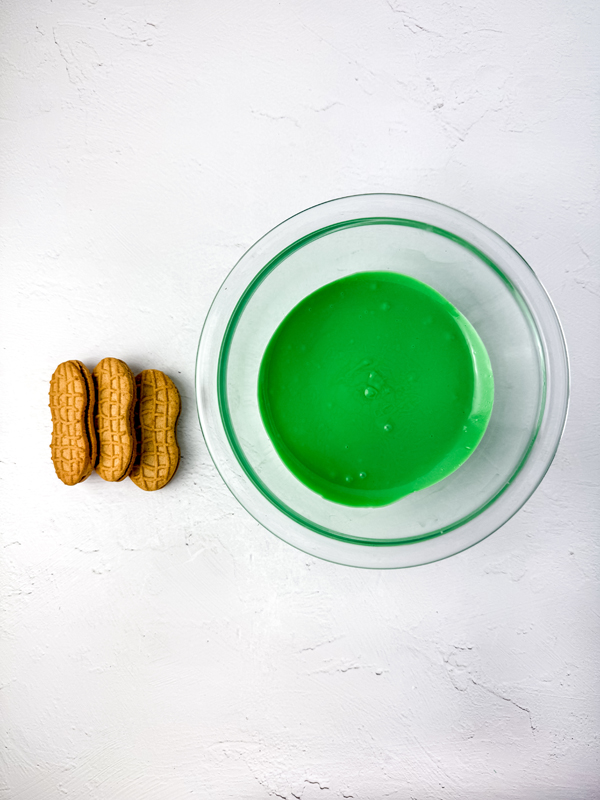 melt the green candy in a bowl