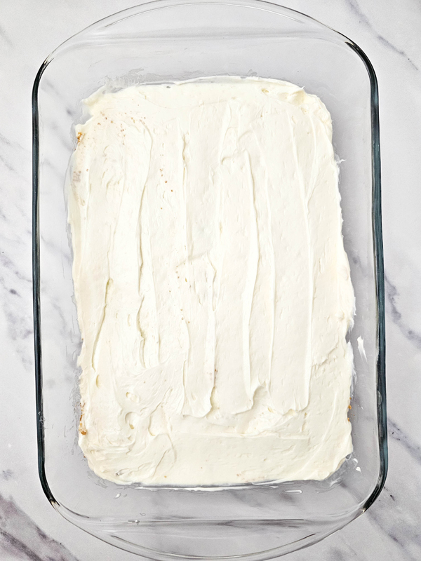 add cheesecake layer on top of the graham cracker layer
