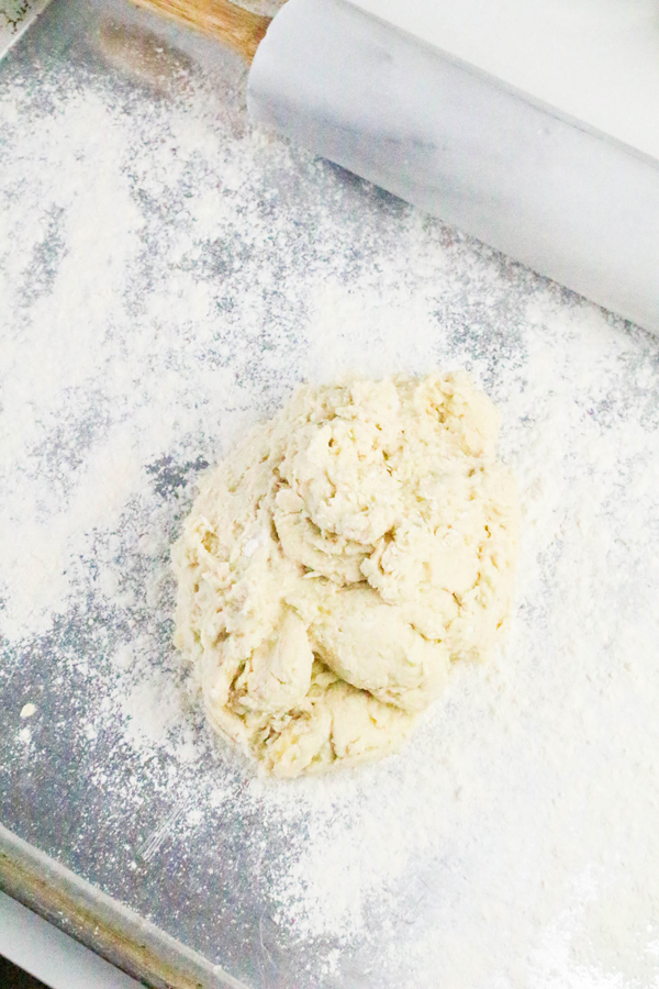 place banana cinnamon roll dough on a floured counter