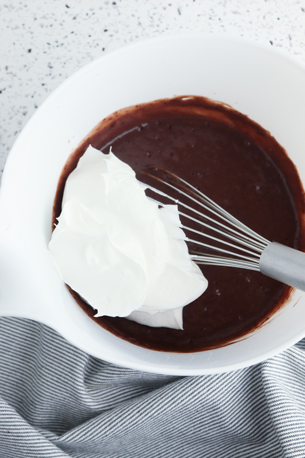 fold 1/2 the whipped topping into the chocolate pudding