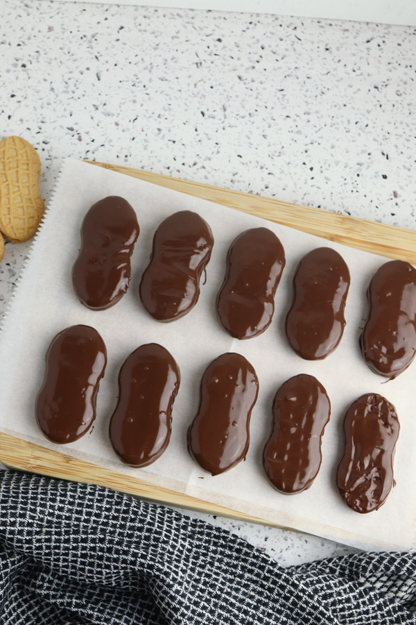 place each chocolate dipped cookie on parchment paper to harden.