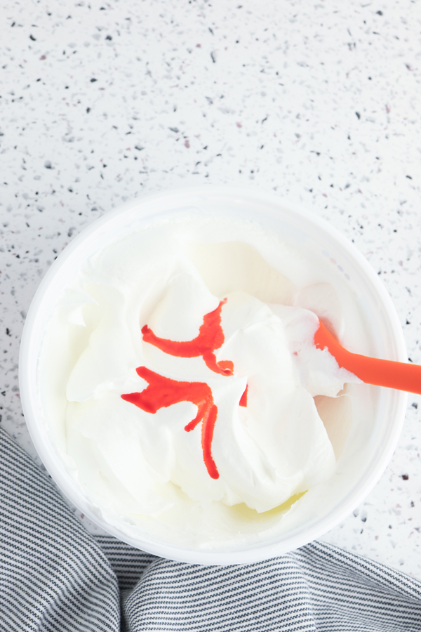 add orange food coloring to the rest of the whipped topping