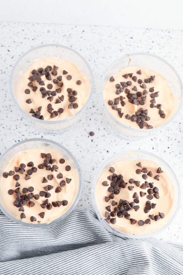 add whipped topping and chocolate chips on top of the brownie and chocolate sauce layer