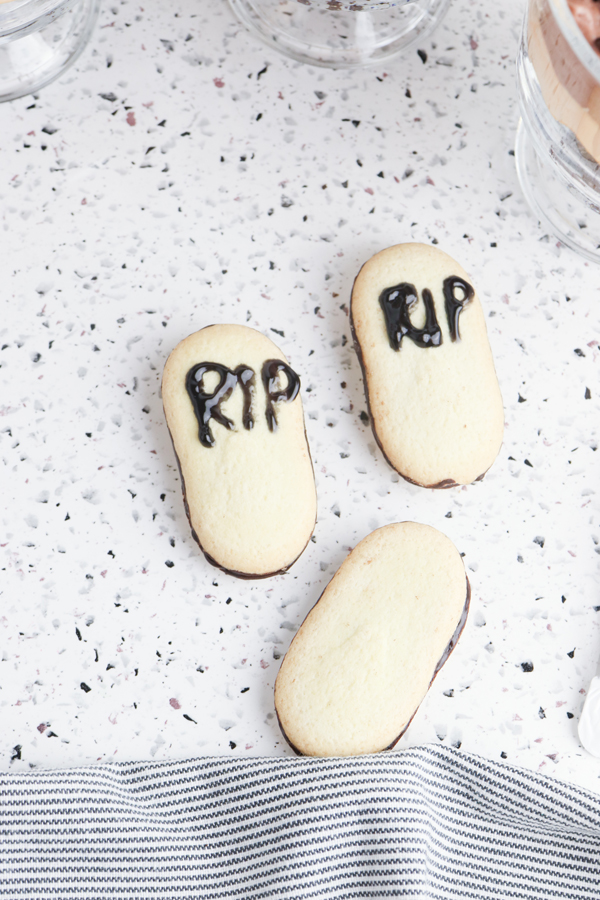 decorate the milano cookies to look like headstones