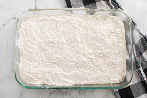 add cake mix to the top of pumpkin mixture